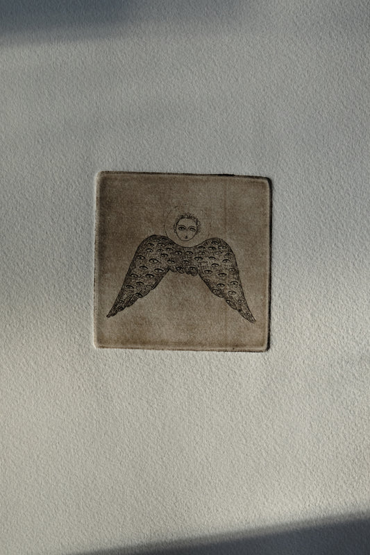 Angel with eyed wing