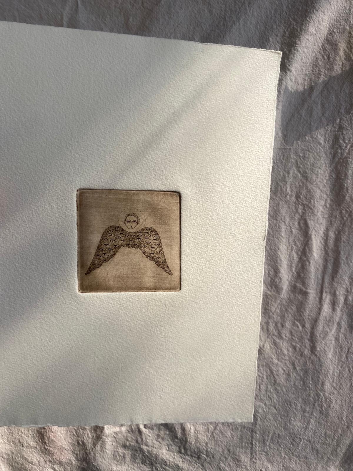 Angel with eyed wing