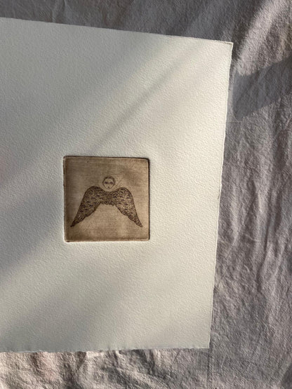 Angel with eyed wing